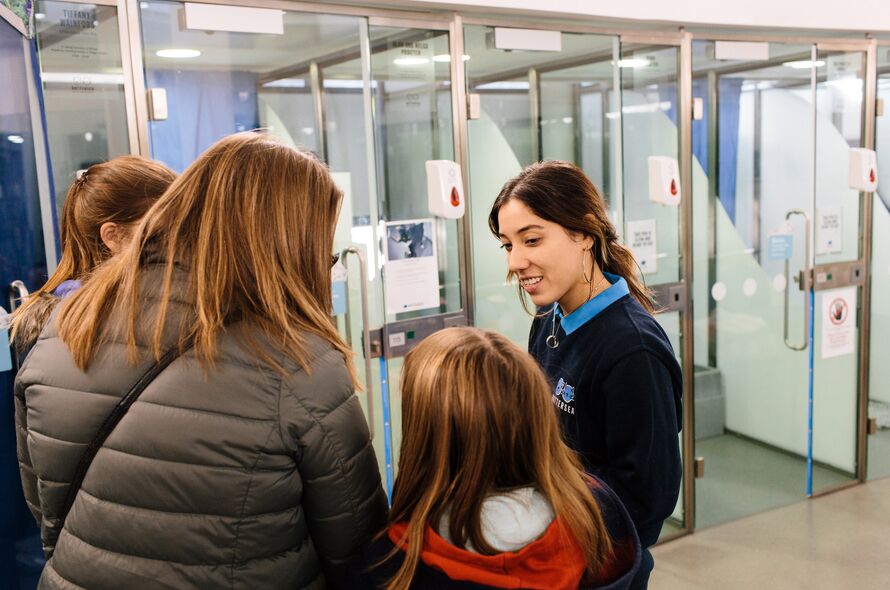 Battersea staff showing members of the public around the London cattery