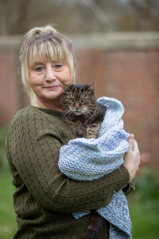 Taz the cat with her owner Mandy